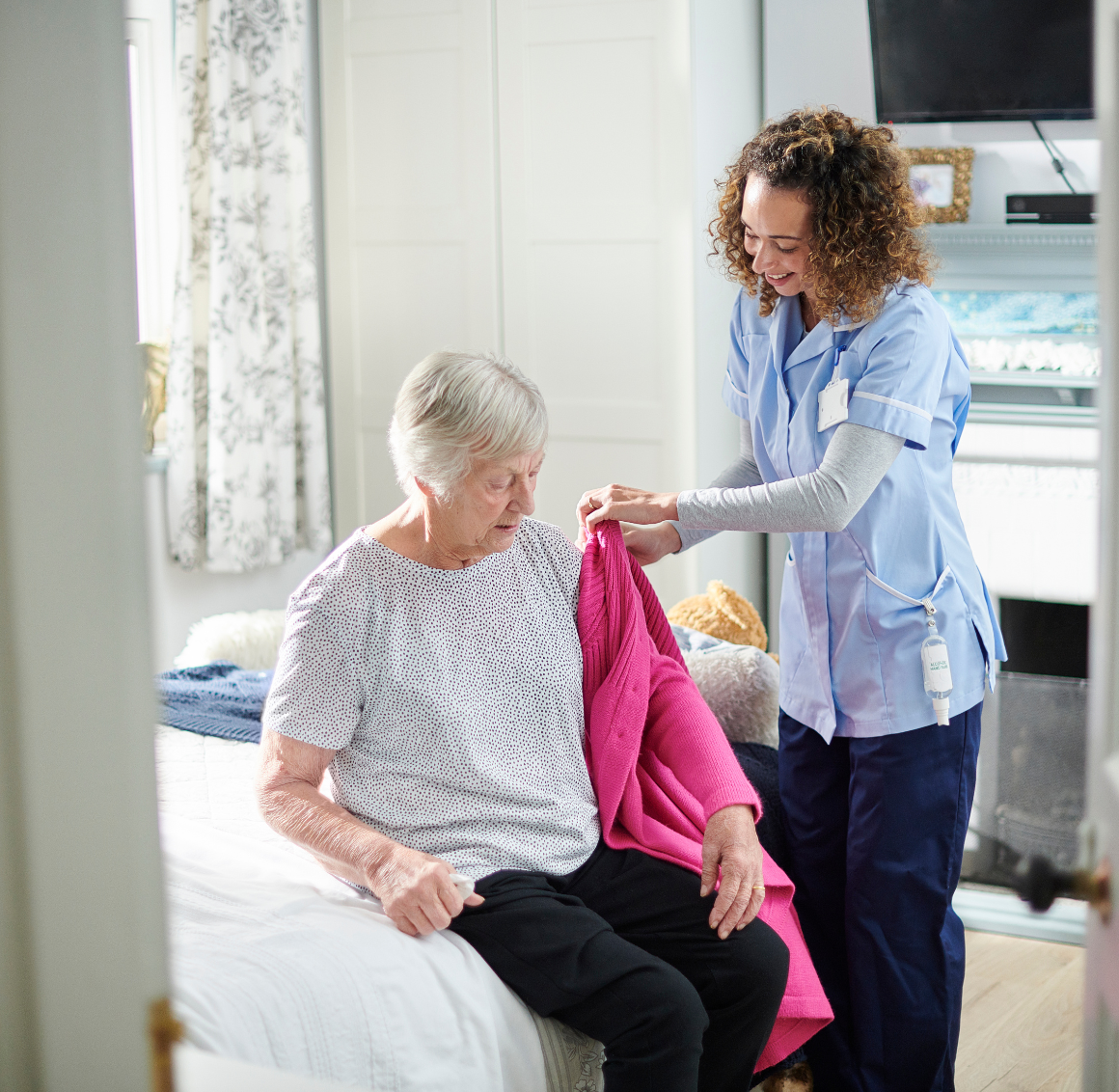 care-assistance caregiver assisting elderly